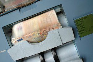 Banknotes being counted in a cash-counting machine