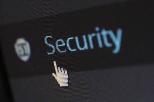 Close-up of a screen showing the word “Security” with a mouse pointer